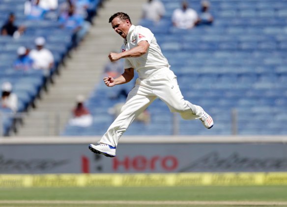 Steve O'Keefe celebrates Virat Kohli's wicket.
