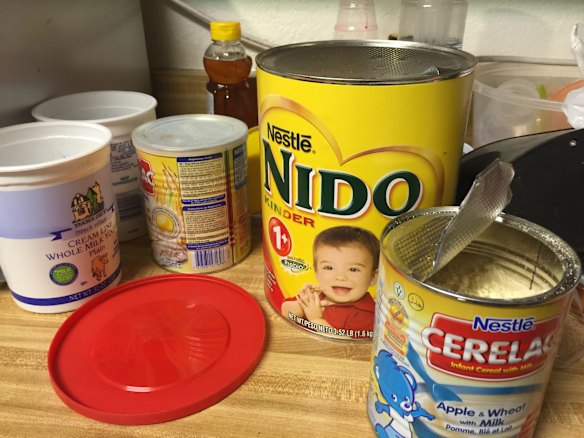 Open tins of baby formula could be seen in the home.