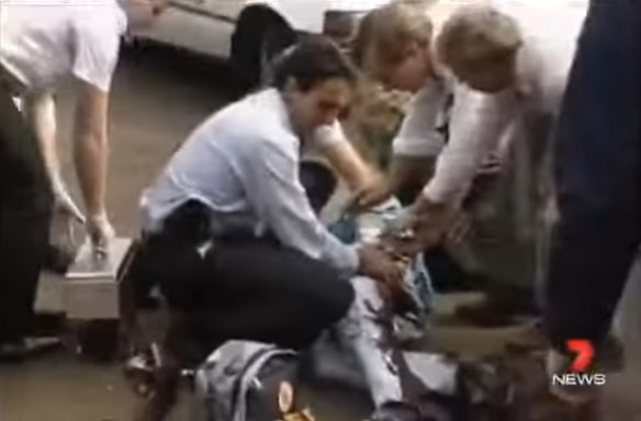 Medics help then Queensland police detective Ross Barnett after he was shot by jailbreaker Harold McSweeney in 1991.