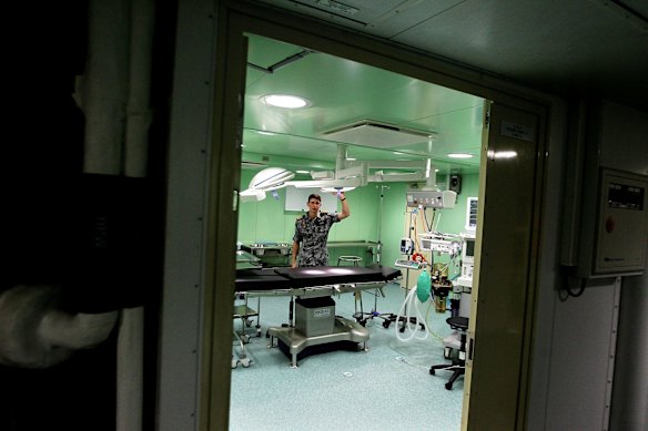 Dr Richard Loizou in the operating theatre.