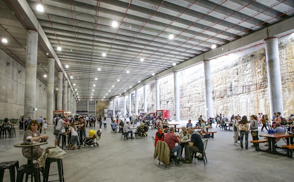 Sydneysiders enjoy a rest and some lunch underneath the parkland.