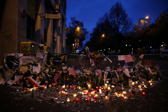 Dawn in Boulevard Voltaire near the Bataclan theatre where a memorial honouring 129 people killed by terrorists grows in Paris, France.