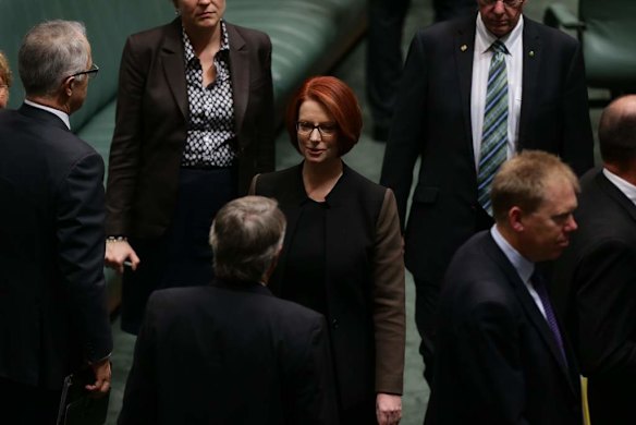 Prime Minister Julia Gillard and Treasurer Wayne Swan depart after a division at Parliament House.