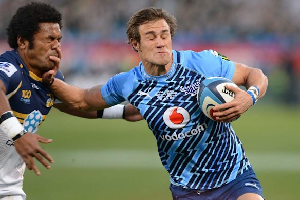 JJ Engelbrecht of the Bulls hands off Henry Speight of the Brumbies.
