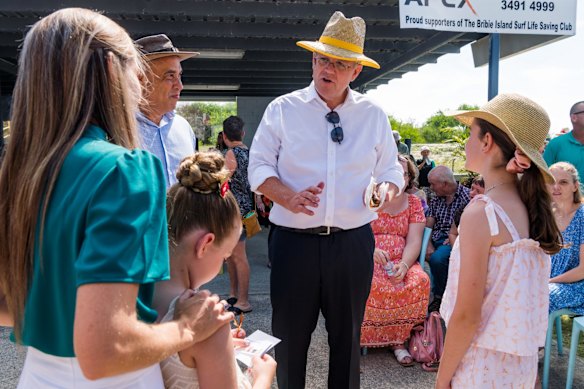 Younger view: Morrison talks to kids on Bribie Island. He says he is "just going to keep being real and authentic like I always have and engage directly with the Australian people".