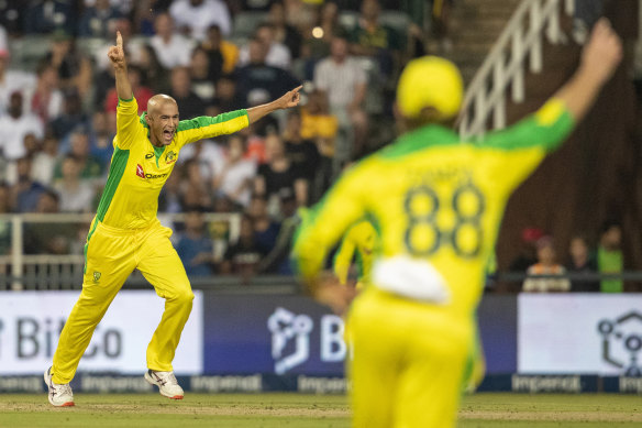 Ashton Agar celebrates with teammates after dismissing South Africa's batsman Dale Steyn.