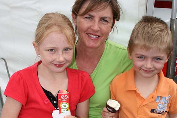 Kiera, Debbie and Pierce Kusters enjoy ice cream on the bridge.