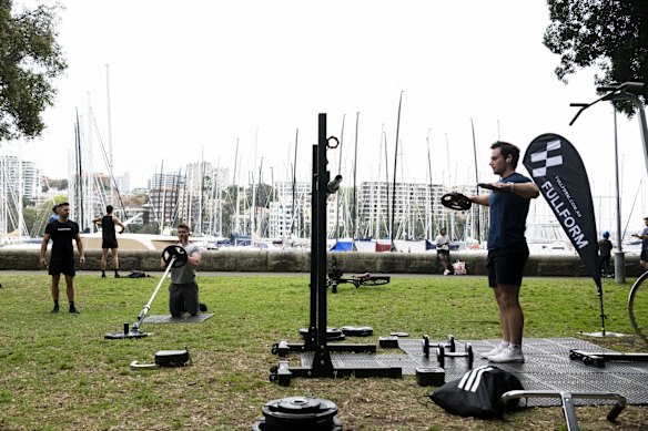 People exercising in Rushcutters Bay Park.