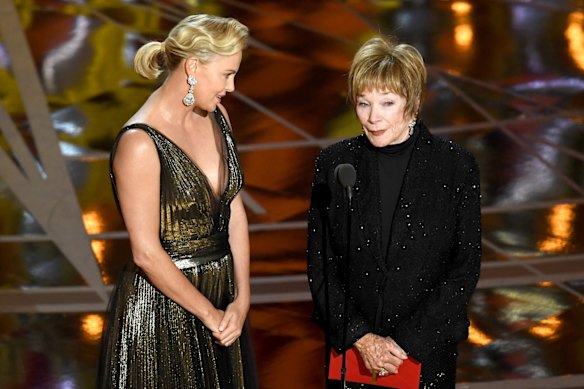 Charlize Theron and Shirley MacLaine on stage at the 89th Academy Awards.