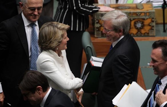 Foreign Affairs Minister Kevin Rudd speaks to Deputy Leader of the Opposition Julie Bishop during a division at question time yesterday.