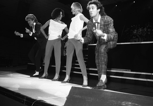 George Michael and Andrew Ridgeley of Wham! pictured with backing singers Pepsi & Shirlie (Helen DeMacque and Shirlie Holliman) performing in Newcastle, 6th December 1984. 