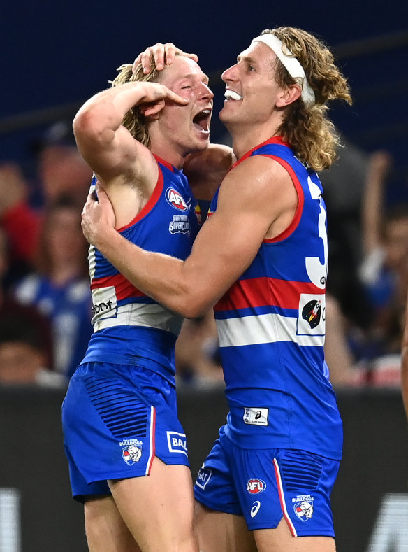 Cody Weightman and Aaron Naughton kicked five goals each in the Bulldogs’ demolition of North Melbourne.