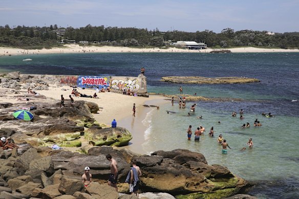 Crowds find refuge from the oppressive heat, swimming at Yarra Bay.