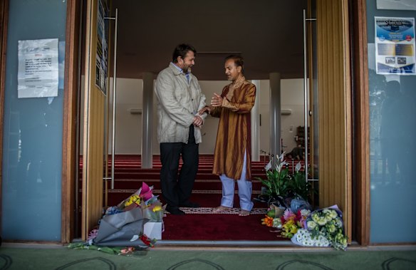 Christchurch man Paul Bradley speaks to Canberra Muslim Community president Mainul Haque at Gungahlin Mosque on Saturday.