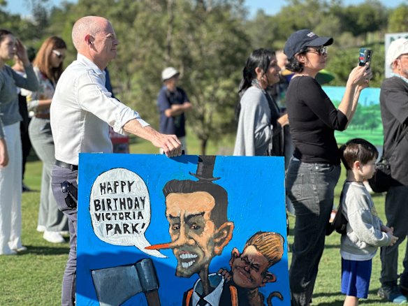 Campbell Newman with an unflattering painting of his former LNP government colleagues David Crisafulli and Jarrod Bleijie.