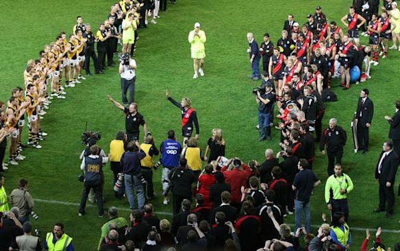 Kevin Sheedy and James Hird leave the MCG for the last time as Essendon coach and player.