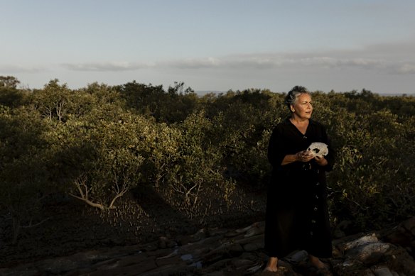 Aboriginal artist, Fiona Foley, in the mangroves at Booral, Queensland.