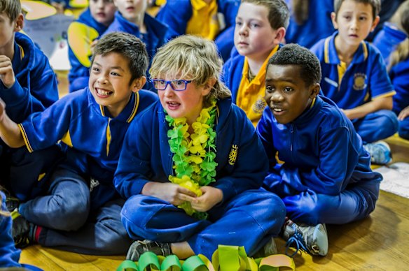 Giralang Primary school. The school where Olympic 400 meter hurdler teaches excitedly watches her compete in the semi-final event at the Rio Olympic games. (from left) Russele Subing-Subing, Sam Rice and Alex Tshibangu. 