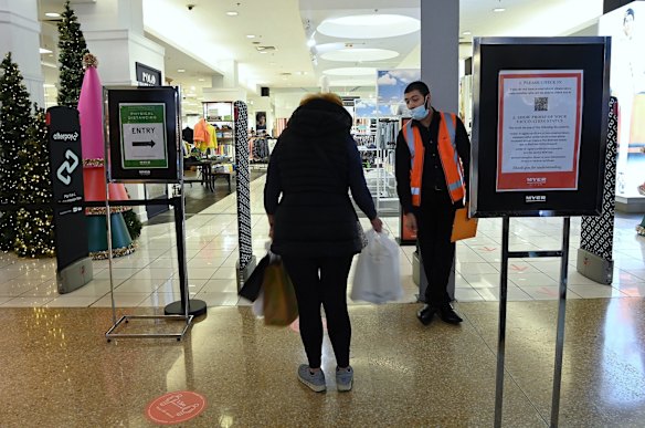 A security guard at the entrance of Myer in the same area of the Myer store that had a historical fleeting transmission early on in the outbreak in Westfield Bondi Junction shopping centre. Today is the first day of relaxed COVID-19 restrictions for fully vaccinated people. 