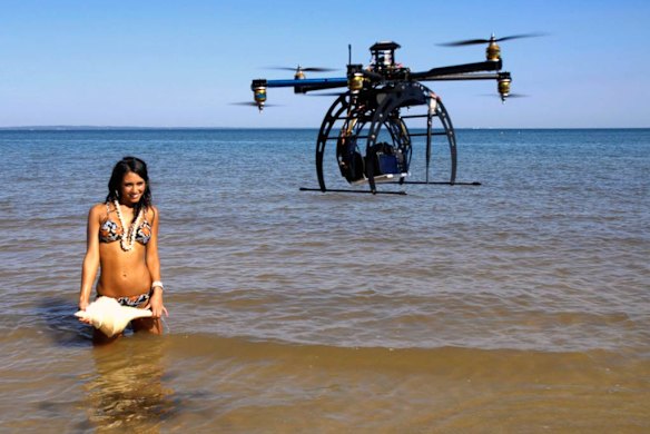 A flying drone is used during a fashion shoot.