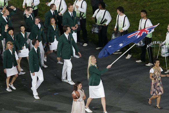 The Australian Olympic team enter the stadium lead by flag bearer Lauren Jackson.