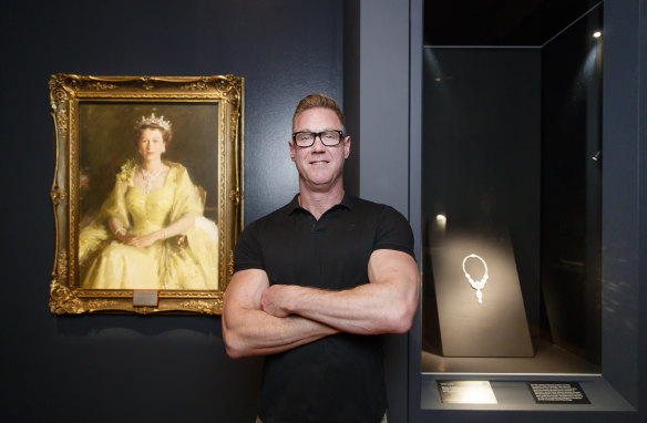 National Gallery of Australia's Adam Worrall with a piece from the Queen's personal collection. 