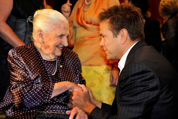 Grandson Lachlan wishes Dame Elisabeth at her 102nd birthday celebrations at the Melbourne Recital Centre.