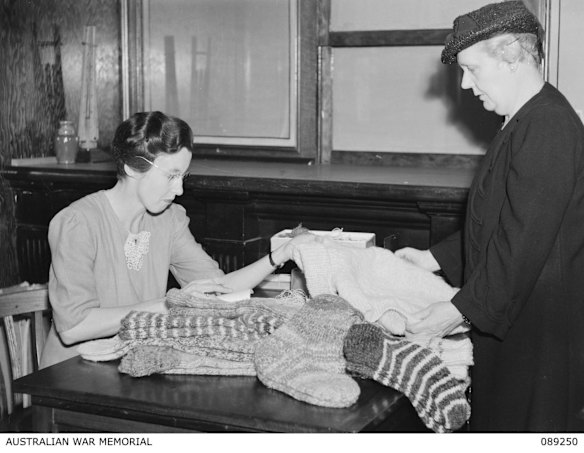 CWA members assessing socks made for the war effort.