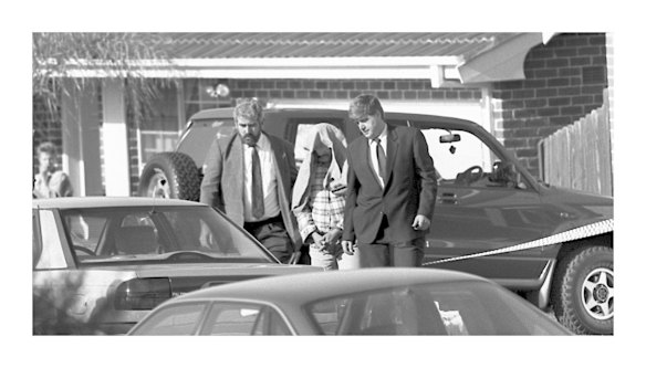 NSW police take away Ivan Milat, the man suspected of the Belanglo Forest backpacker murders, from his Eaglevale home after an early morning raid, July 1, 1995.
