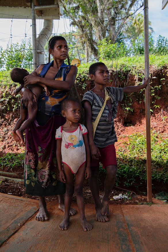 Wayame Dafu with her children visiting Mougulu health centre.