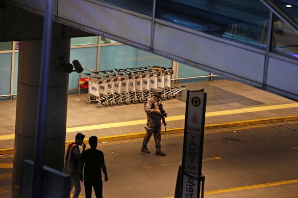 Turkish security officers gather outside Istanbul's Ataturk airport.