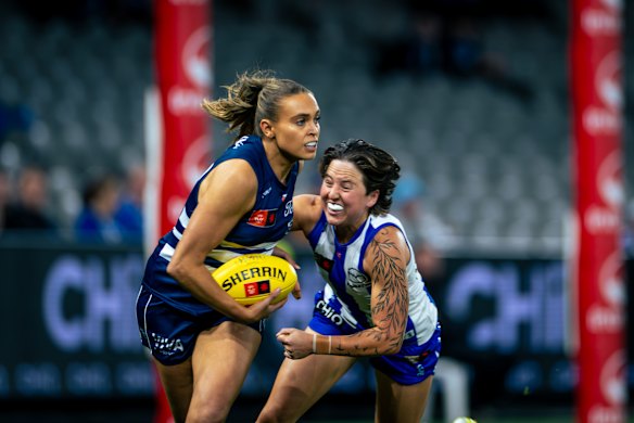 Get away: The Cats and Kangaroos worked hard at Marvel Stadium on Saturday.