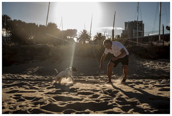 Miss Maudie playing at the beach with Neil McMahon.