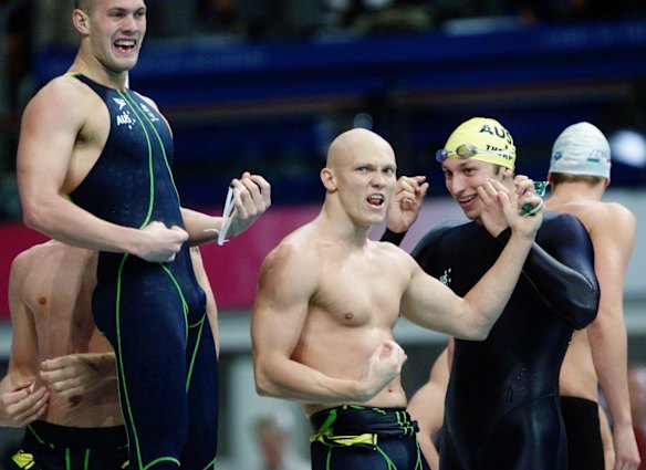 Australian swimmer Michael Klim pretends to play the guitar after Australian defeated the USA in the Men's 4x100m freestyle relay final.