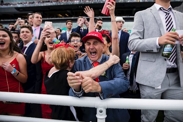 Punters celebrate Redzel winning the TAB Everest horse race held at Royal Randwick Racecourse.