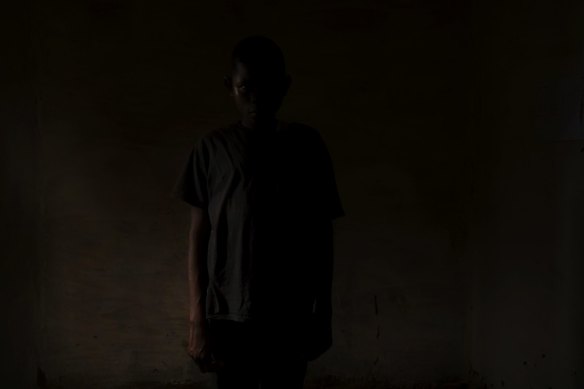 Former child soldier Victor, 15, in a child friendly space. Victor joined the Kamuina Nsapu militia in early 2017. He killed one government (FARDC) soldier, which he also beheaded. He then burnt the head in the fire, ground up the bones and ashes and then mixed it with alcohol to make a magic potion which he drank to increase his powers.  