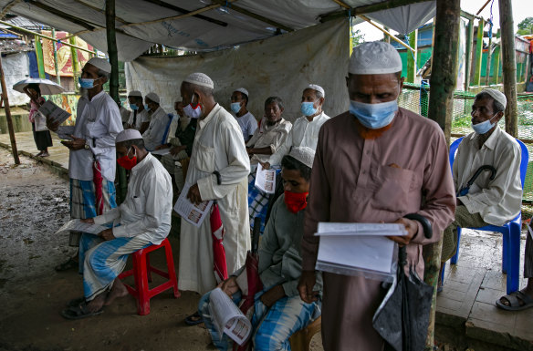 Refugees wait to be vaccinated in a Rohingya refugee camp in Cox’s Bazar, Bangladesh. 