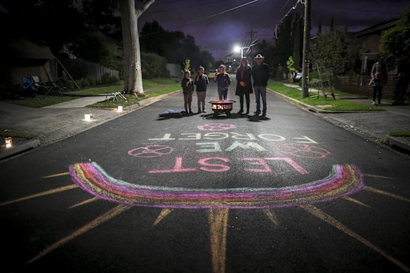 Residents Mark Di Pasquale and wife Christine with daughters, Jessica 10, Elouise 9, Alexis 7 in Clara Street, Macleod setup a small dawn service on Anzac day. 25 April 2020. 