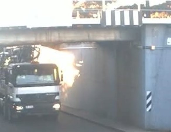 The truck hit the rail bridge at Corinda on Monday morning.