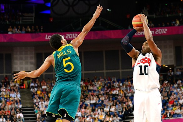 2012: Kobe Bryant of the United States shoots over Patrick Mills of Australia in the third quarter during the Men's Basketball quaterfinal game at the London 2012 Olympic Games in London, England. 