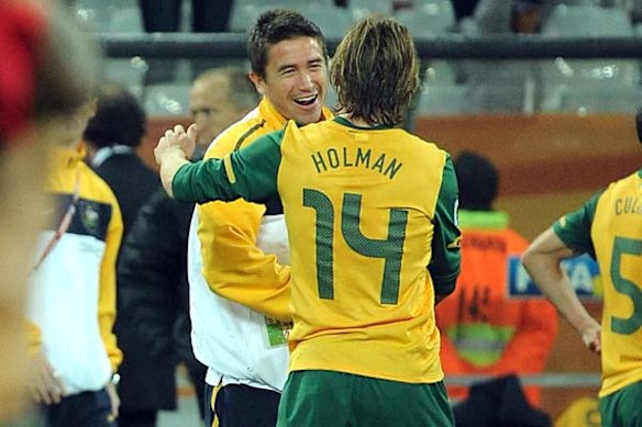 Harry Kewell congratulates Brett Holman