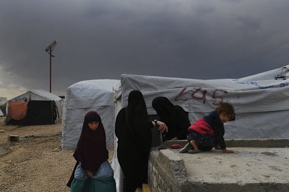 Women and children in the foreign annex, infront of a tent in Al-Hawl camp in North East Syria. 