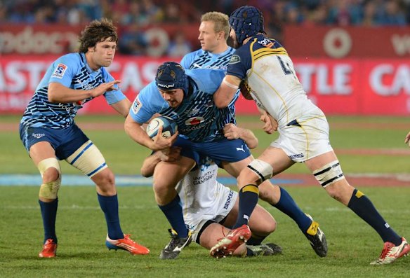 Frik Kirsten of the Bulls is tackled by Scott Fardy of the Brumbies.