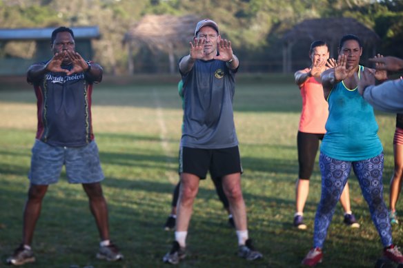 Prime Minister Tony Abbott doing physical training with members of the Bamaga community, during his visit to Cape York, on Friday 28 August 2015. 