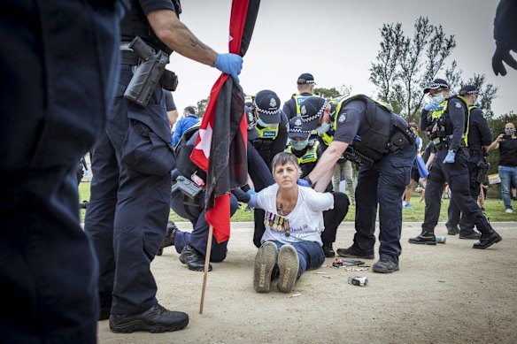 Police clash with protesters at the Shrine.