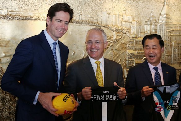 Chinese billionaire Gui Guojie's passion for Port Adelaide remains undiminished – pictured here with AFL's Gil McLachlan and PM Turnbull 