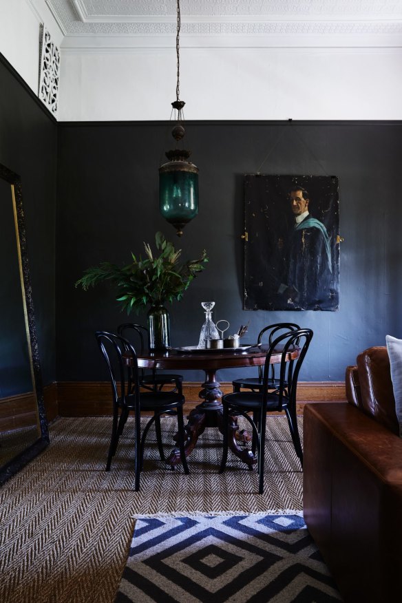Walls in the formal lounge are painted a deep grey (Gravel by Resene) and the furniture is a mix of family heirlooms and items from auction houses.