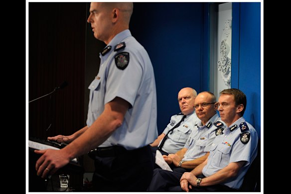 Assistant commissioners Keiren Walshe , Ken Lahey and  Ken Jones  look on as Chief Commissioner Simon Overland chats to media representatives at the Victoria Police Centre on the 25th of May,  2009. Photo by Craig Abraham.