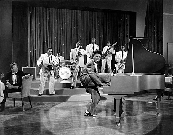 Musician Little Richard performs onstage with his band in 1956.