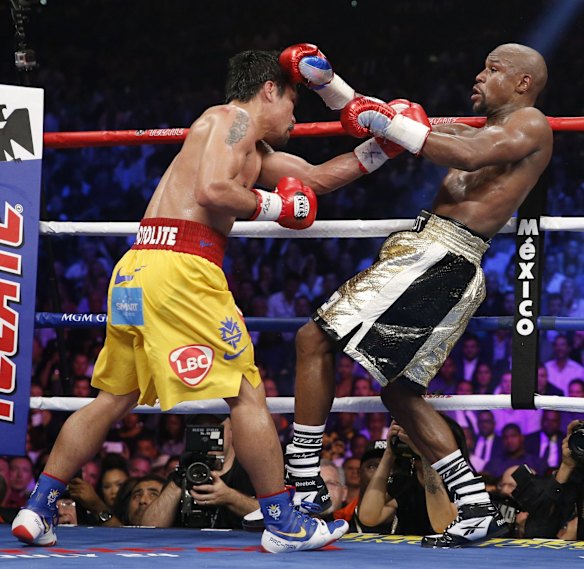 Manny trades blows with Floyd.